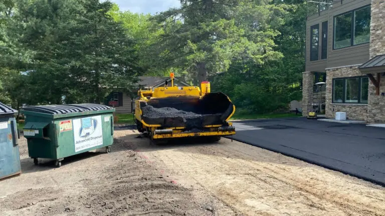 Video-cover-image Davis Construction Company image of them laying asphalt that links to a video