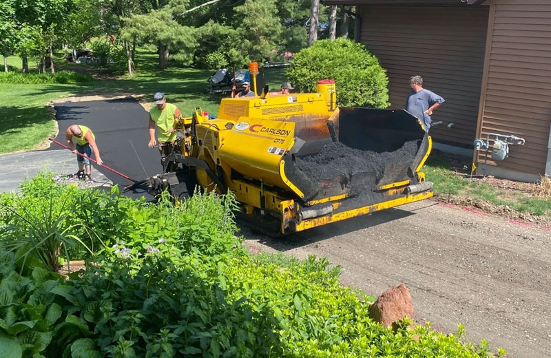 Picture Of Davis Construction laying down Asphalt in a driveway