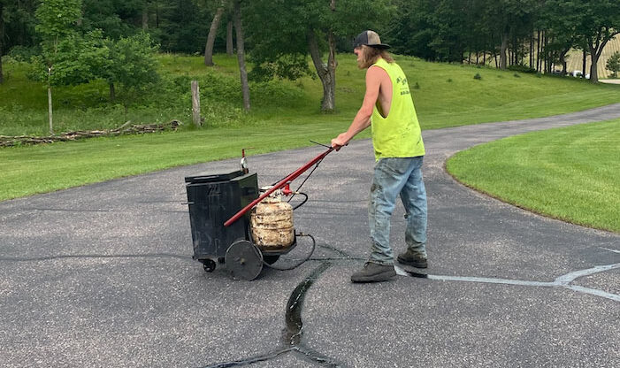 Davis Construction performing a crack sealing service