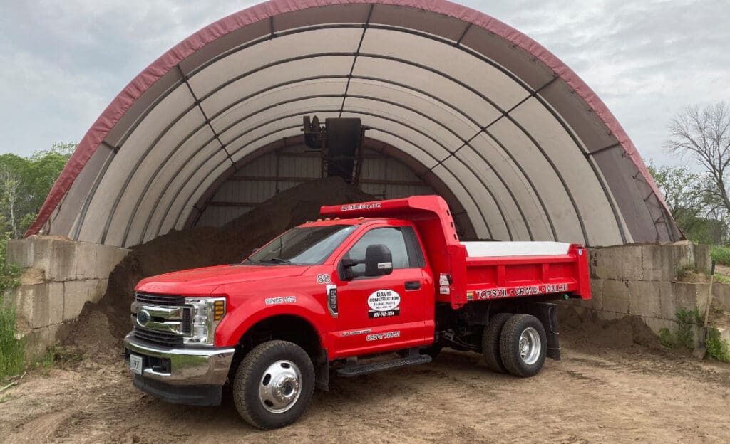 New-Truck-in-front-of-top-soil New truck in-front of pile pf topsoil available for sale
